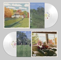 a white lp with two pictures of people in a field